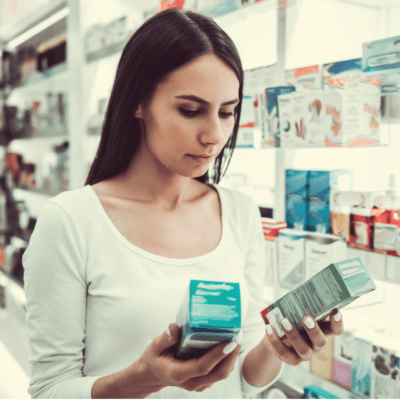 Woman Comparing Products in Store